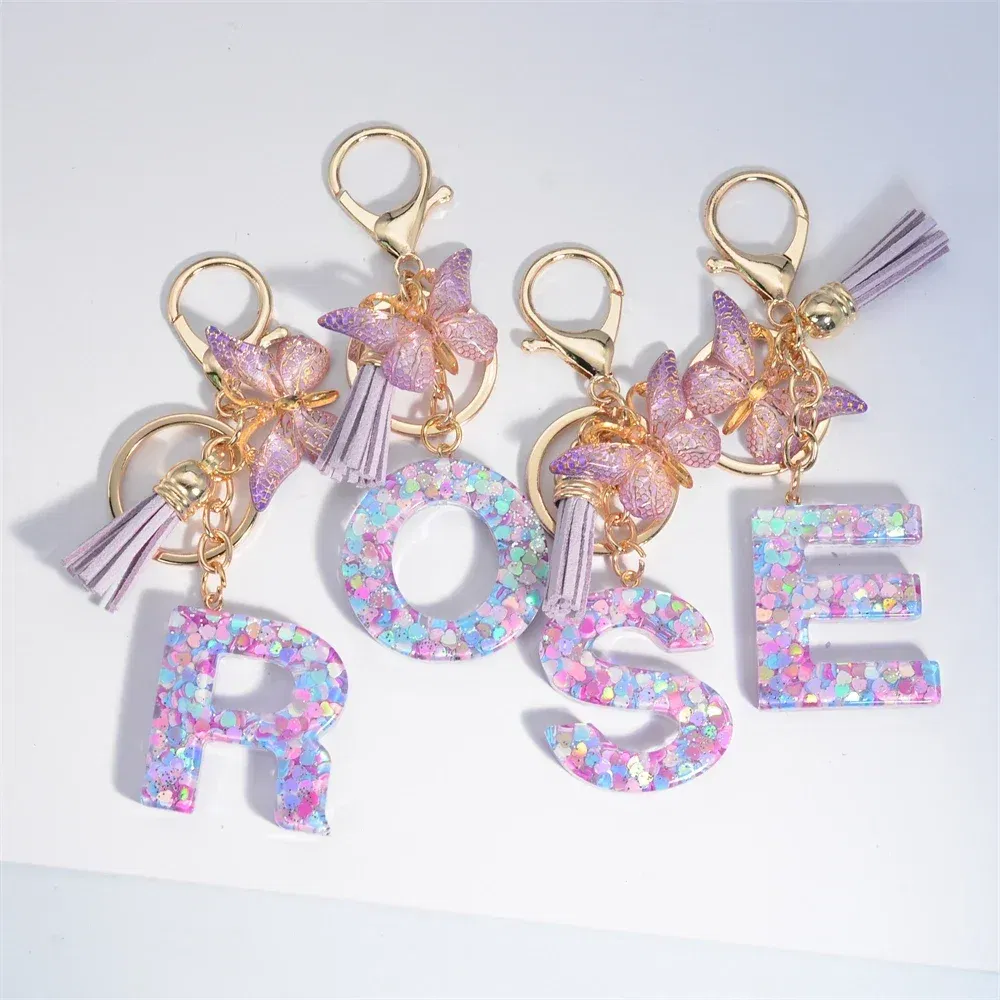 Color: black - Fashion Tassel Butterfly 26Letter Keychain Colorful Love Heart Filled Resin Alphabet Keyring Women Girls Car Bag Phone Pendant
