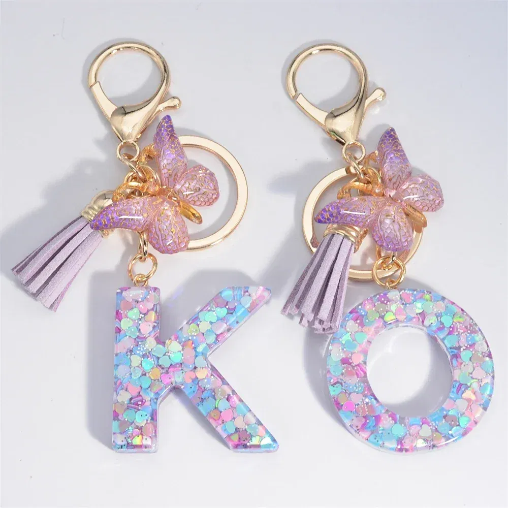 Color: black - Fashion Tassel Butterfly 26Letter Keychain Colorful Love Heart Filled Resin Alphabet Keyring Women Girls Car Bag Phone Pendant