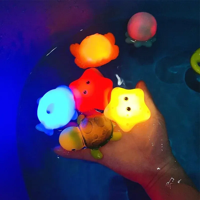 Color: black - Baby Cute Animals Bath Toy Swimming Water LED Light Up Toys Soft Rubber Float Induction Luminous Frogs for Kids Play Funny Gifts