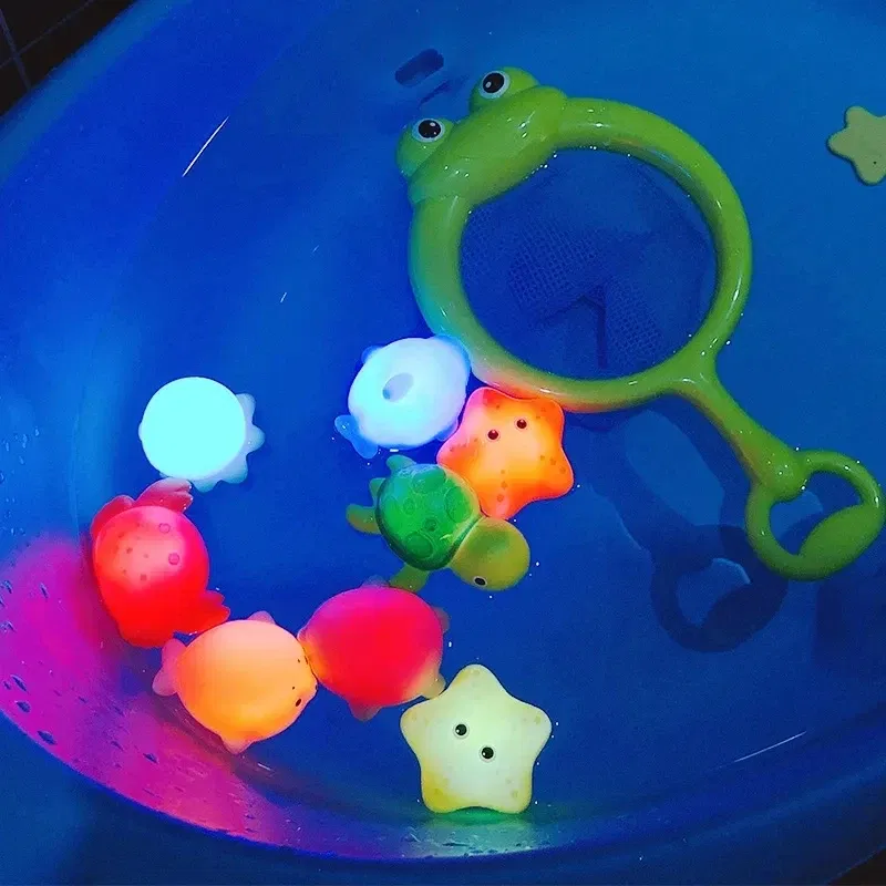 Color: black - Baby Cute Animals Bath Toy Swimming Water LED Light Up Toys Soft Rubber Float Induction Luminous Frogs for Kids Play Funny Gifts
