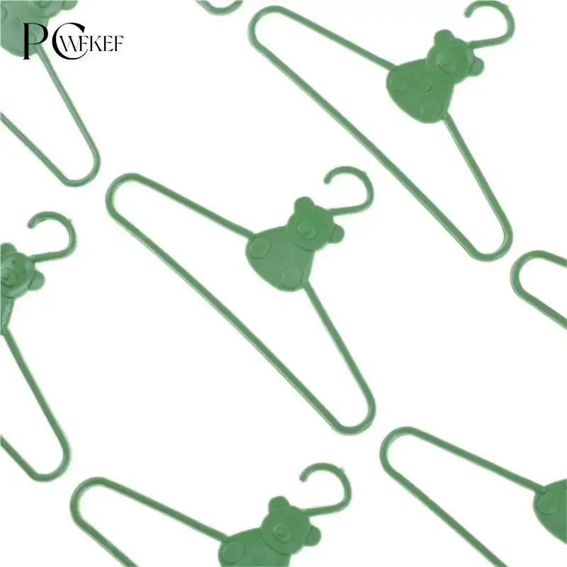 Color: plum - 10/20 PCS / Lot Lovely Green Hangers Mini Cute Wardrobe Dress Coat Clothes Plastic Accessories For Babi Doll Dollhouse Gift Toy