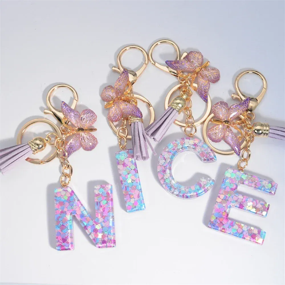 Color: Khaki - Fashion Tassel Butterfly 26Letter Keychain Colorful Love Heart Filled Resin Alphabet Keyring Women Girls Car Bag Phone Pendant