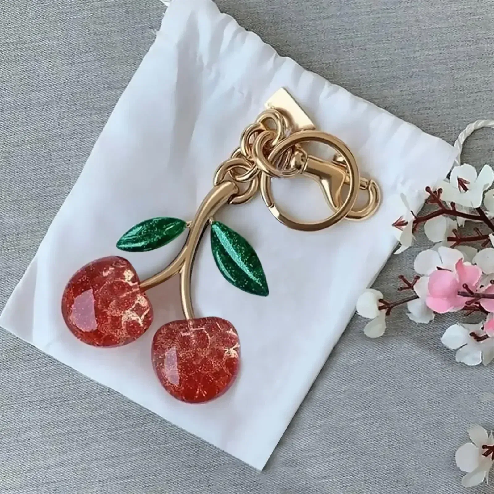 Color: WHITE - Cherry Bag Charm Cherry Keychain Charm Metal Accessory Sparkling Resin For Coach Purses And Bags, Red, Black, Pink