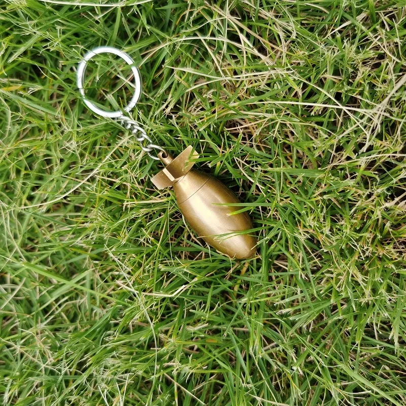 A Brass Bomb Shaped Medicine Bottle Keychain