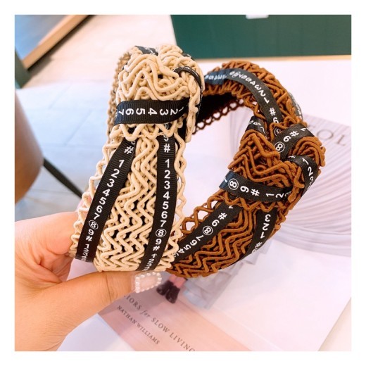 Handmade twisted letter ribbon with knotted headband in the middle