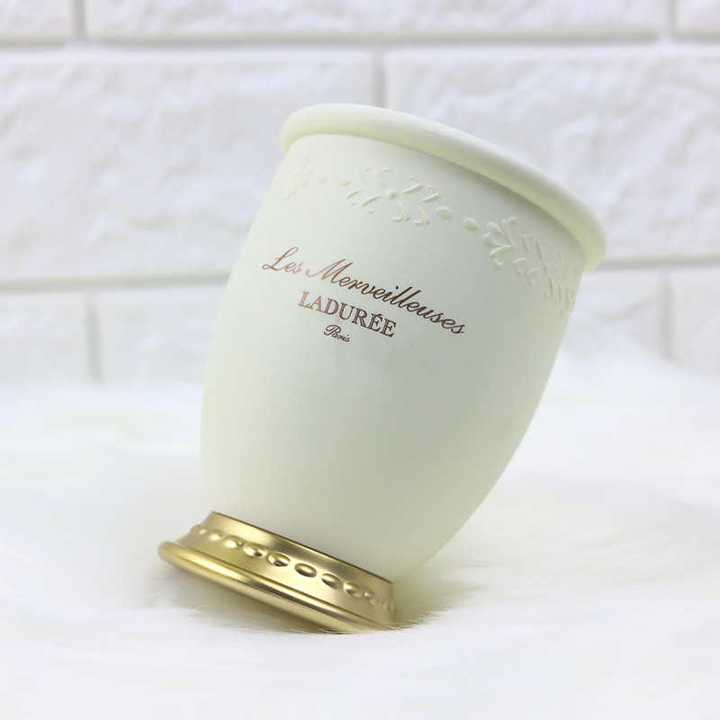 Embossed makeup brush tube